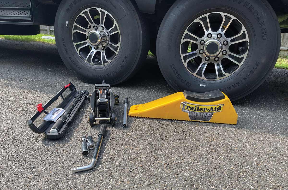 A torque wrench, a trolly jack (small floor jack), wrench, thin-wall socket and a Trailer Aid PLUS