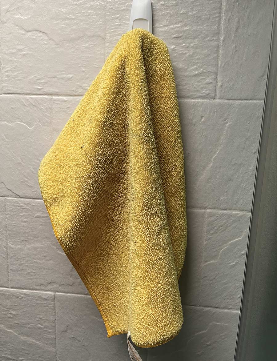 Alien tape being used to secure a towel hook