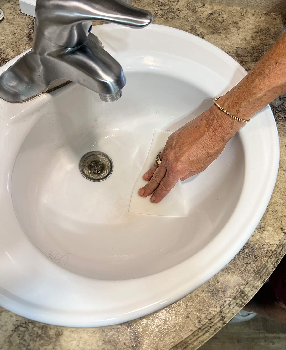 wiping down the sink