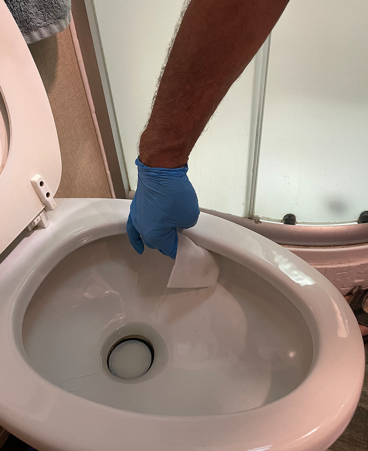 wiping the inside of the toilet