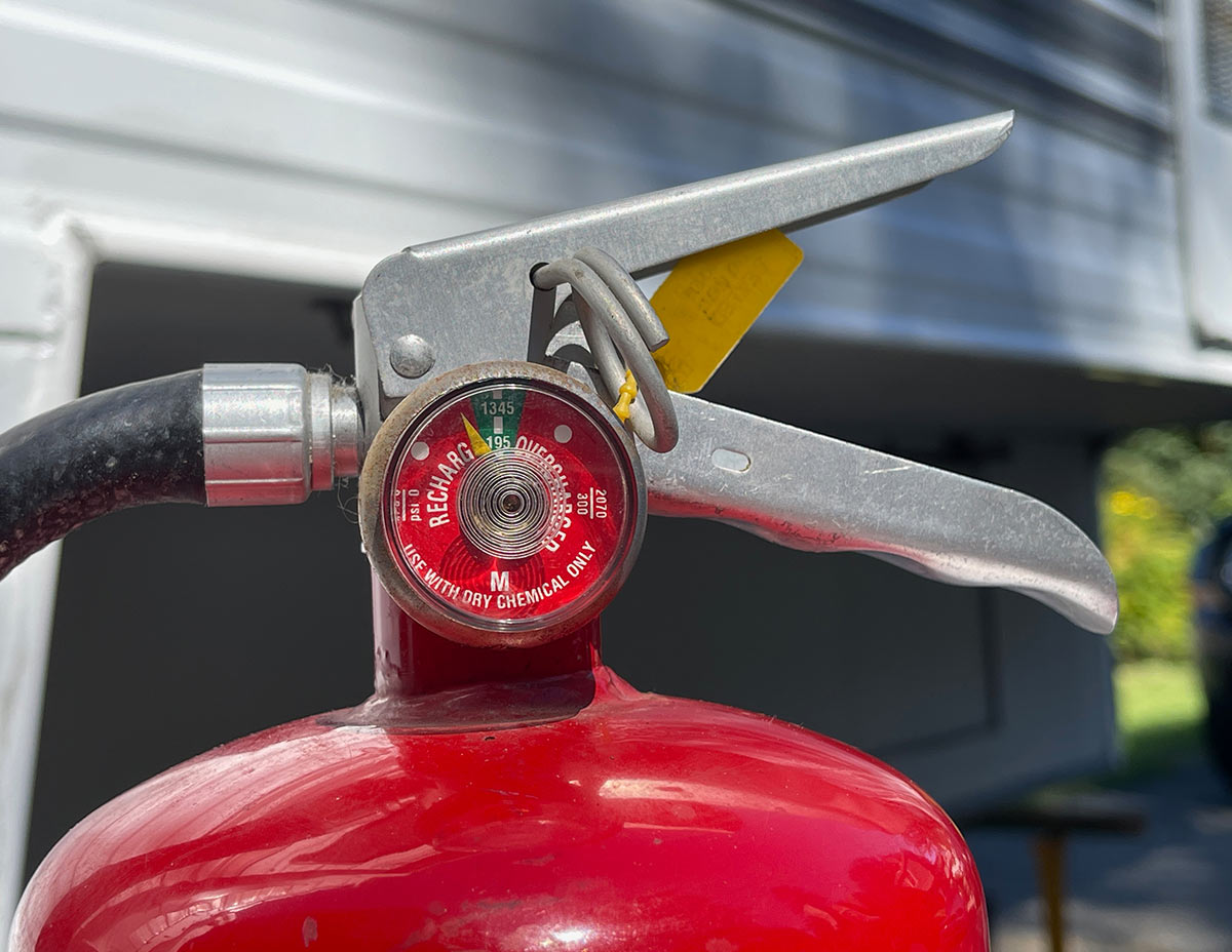 a close-up of the top of the fire extinguisher