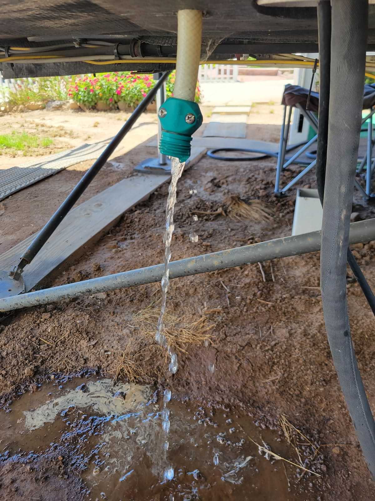 a hose drainig water from beneath the RV