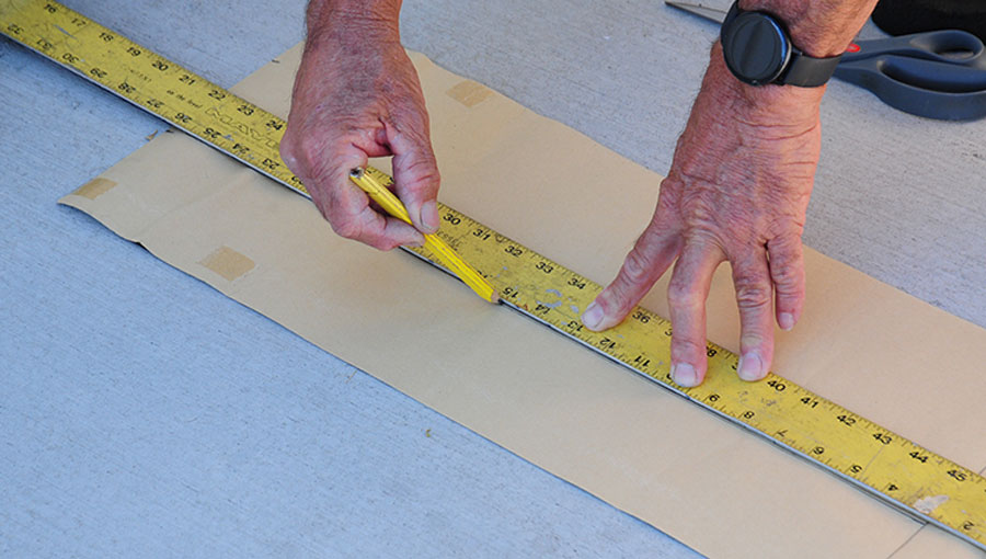 Using Skateboard Grip Tape sheets is unconventional but resulted in material that is durable and lasts a long time. Here, the sheets are cut to size to fit the entry step rungs