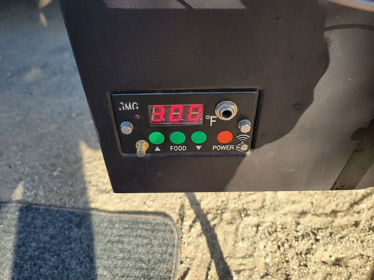 close view of the grill controls and temperature screen