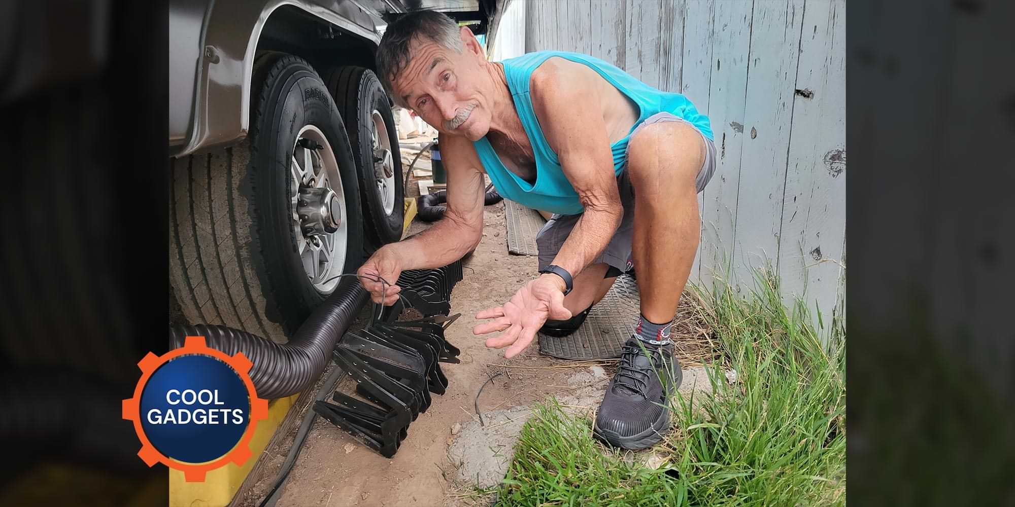 RV technician in the process of securing a sewer hose with zip ties