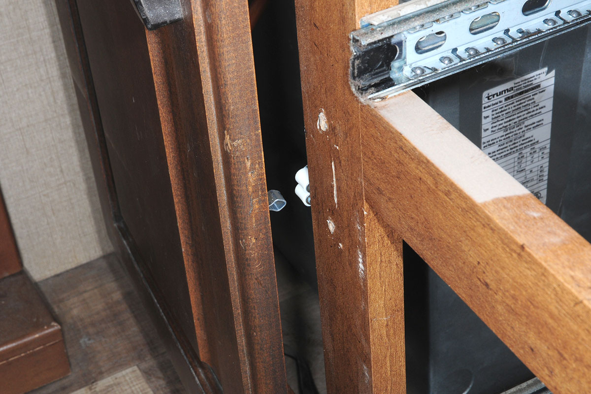 view of the new latching mechanism on the cabinet door