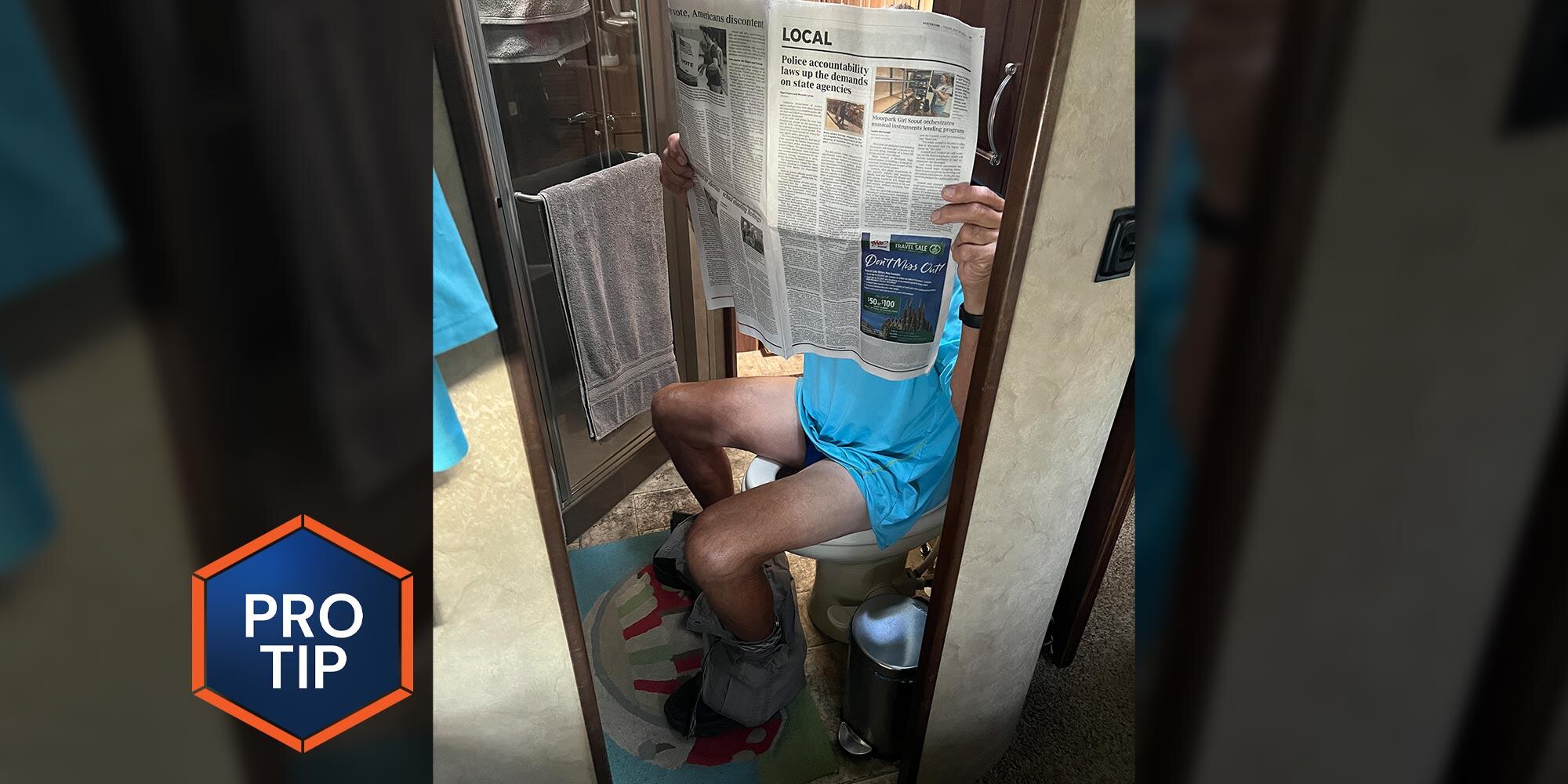 a man sits on an RV toilet seat holding a newspaper