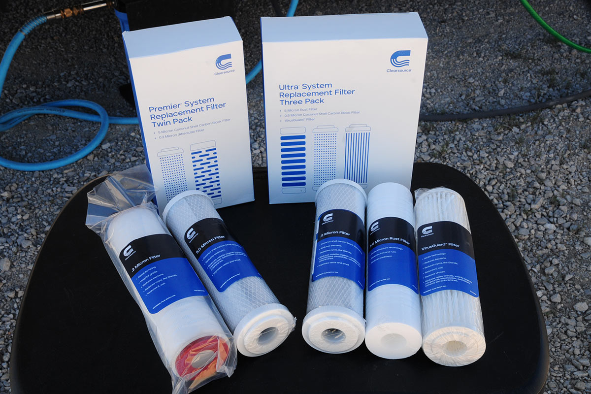 replacement filters for both Premier and Ultra systems sit on a surface in front of each's packaging