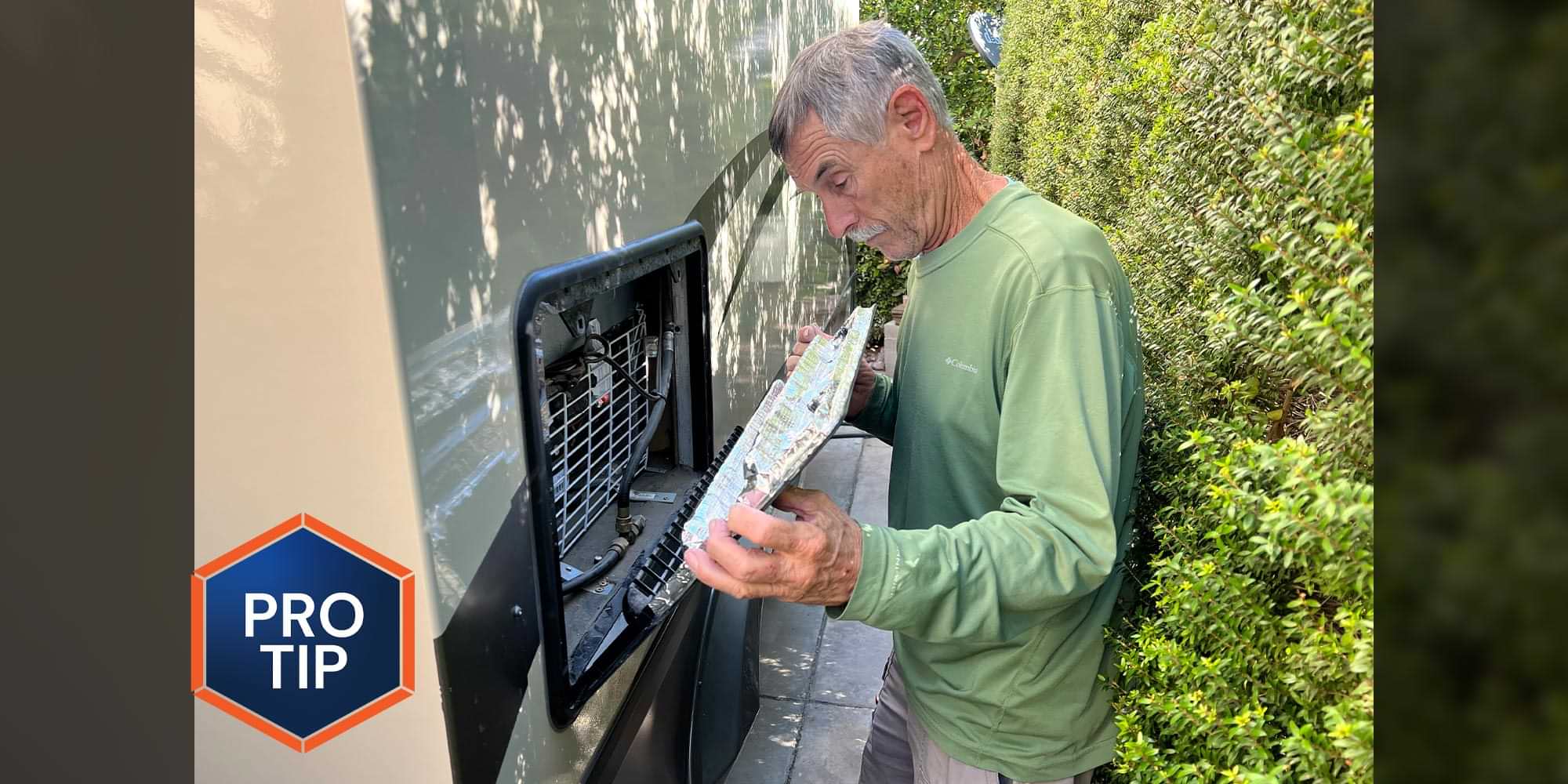a man replaces the covering to a vent on the outside of an RV