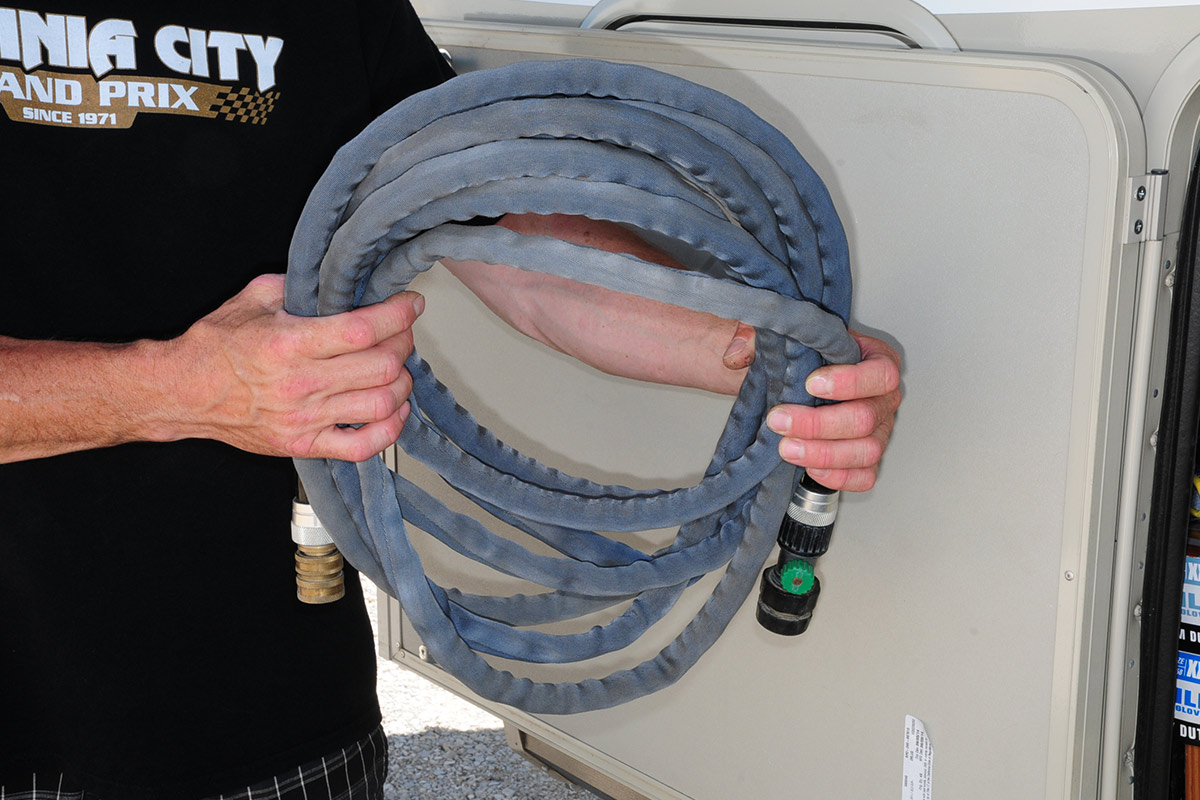 a man holds the Zero G hose in two hands