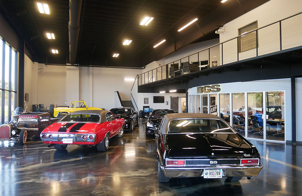 view inside the 7,500-square-foot showroom, where vintage automobiles are parked for display