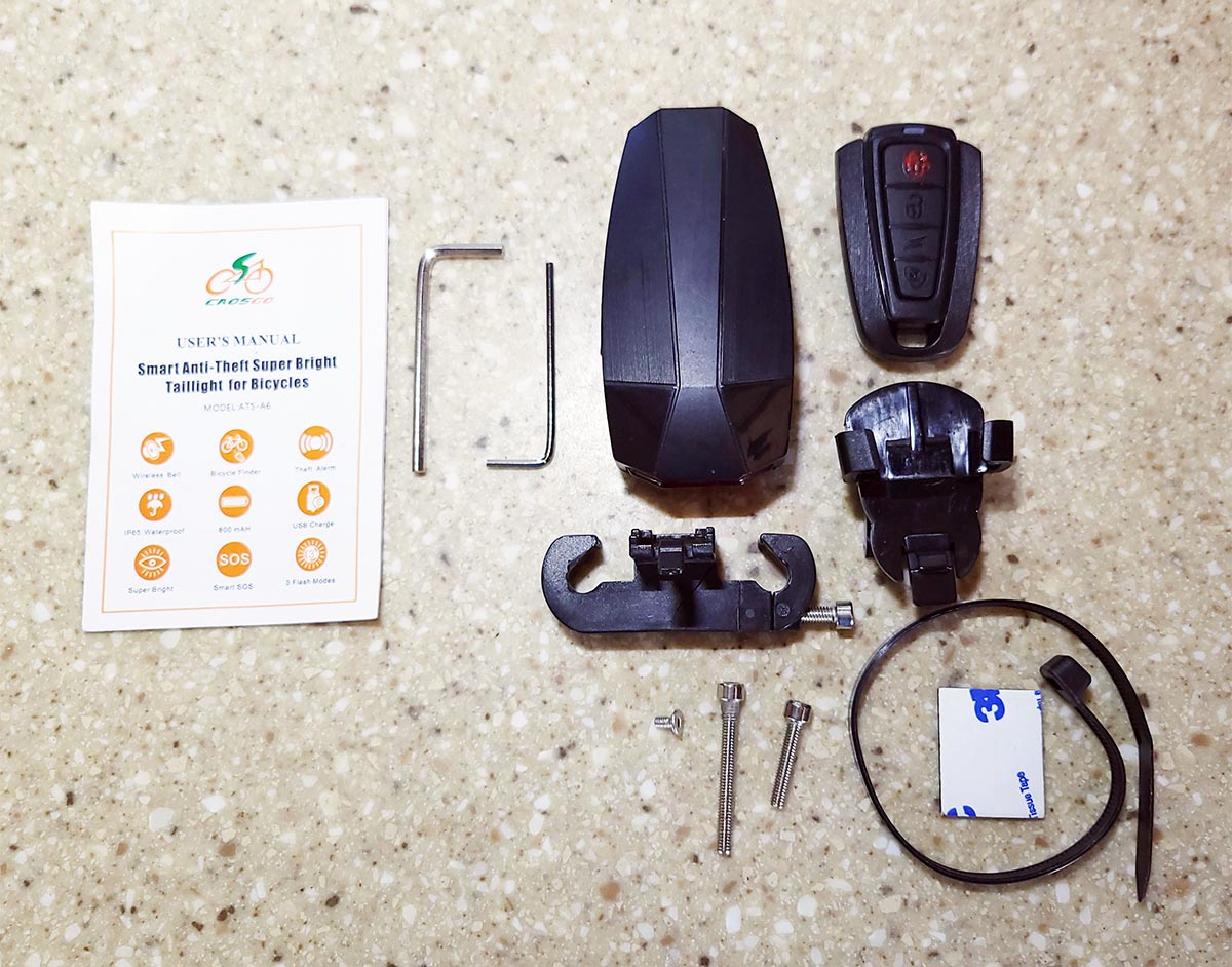 components from a bike alarm kit sit on a counter top