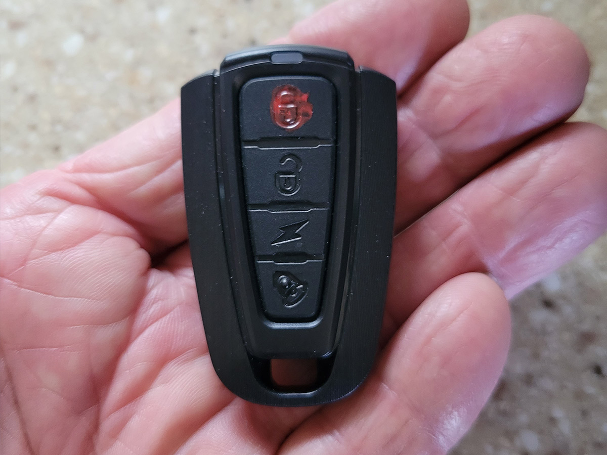 close up of the bike alarm key fob held in a hand
