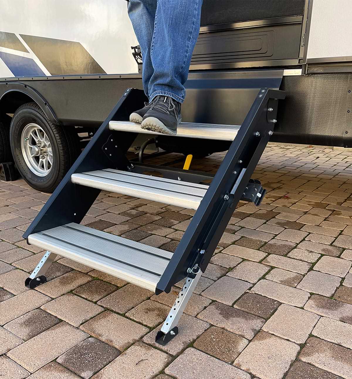 feet walk travel down the adjustable leg entry steps of an RV