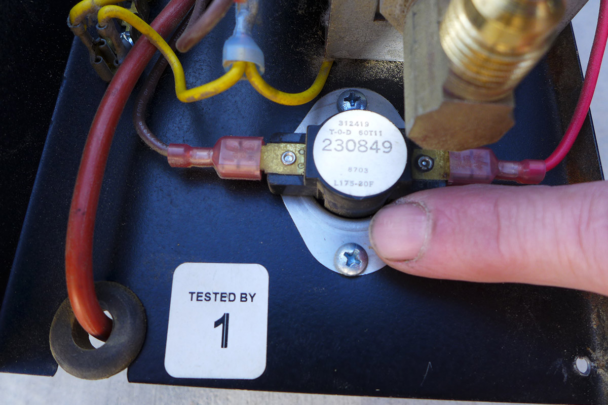 close view of a finger pointing to the limit switch