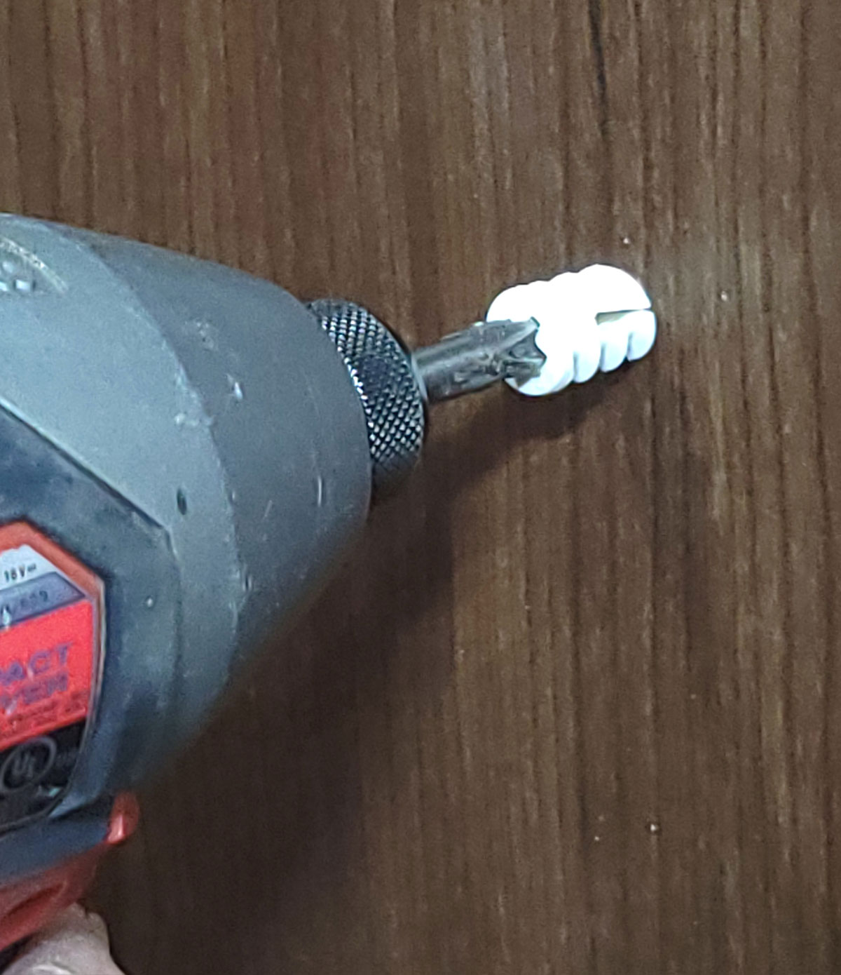 an impact driver on a low torque setting is used to start the plastic anchor
