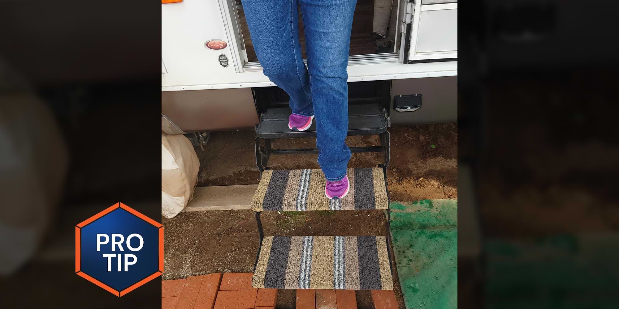 a woman's legs walking down the entry steps of an RV