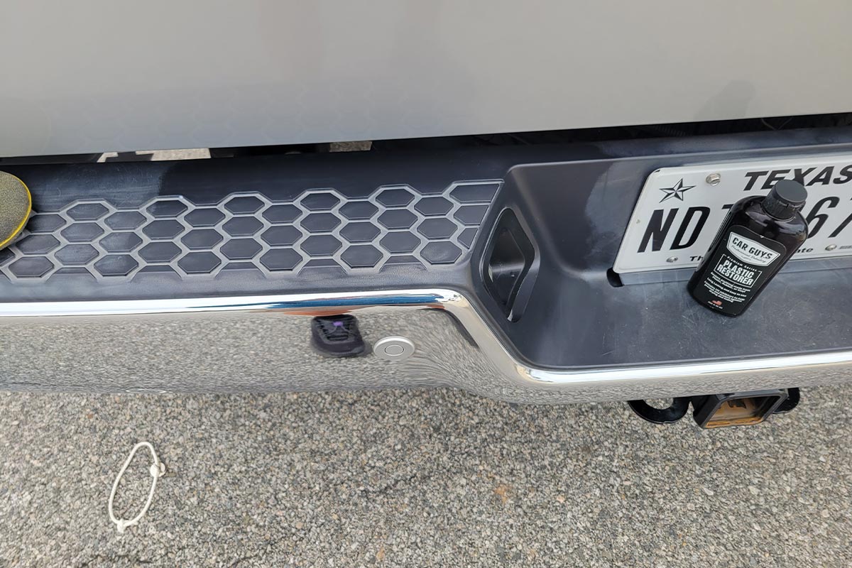 view of the plastic trim on the top of the bumper a 2017 Ram 3500, with an area restored
