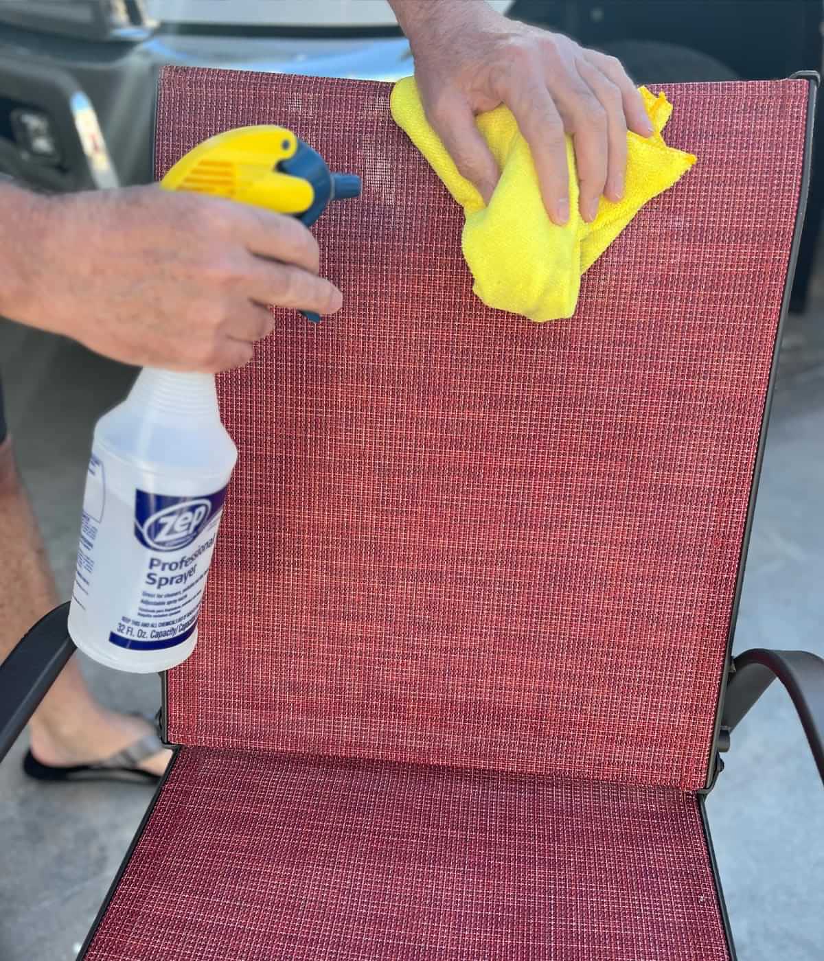 a spray bottle with Voom! cleaner and a microfiber towel are used to clean a patio chair