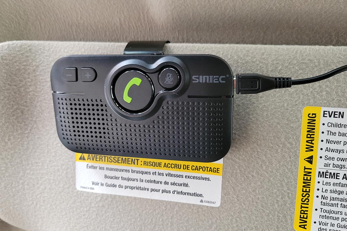 close view of the Sunitec Bluetooth module attached to a sun shade on a vehicle