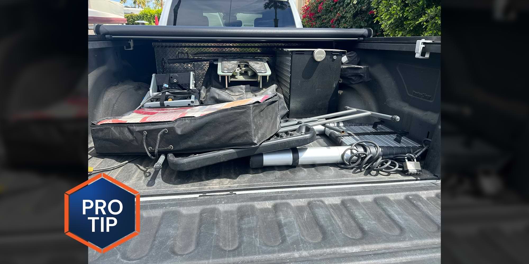 close view of a truck bed with many items of different sizes strewn about