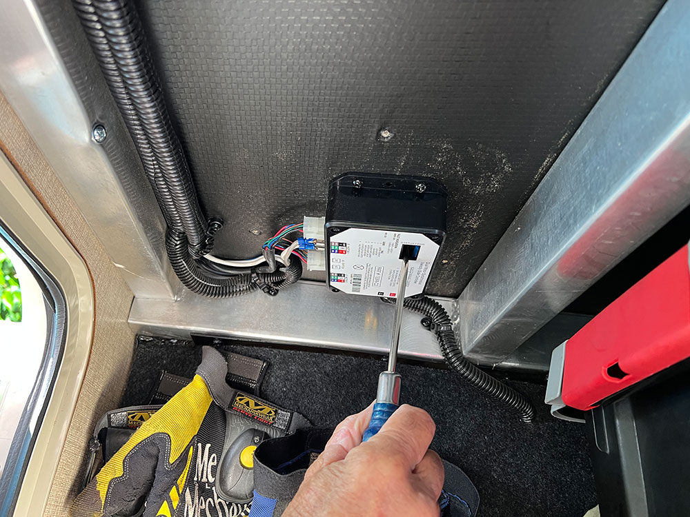 holding button down with screw driver on control panel