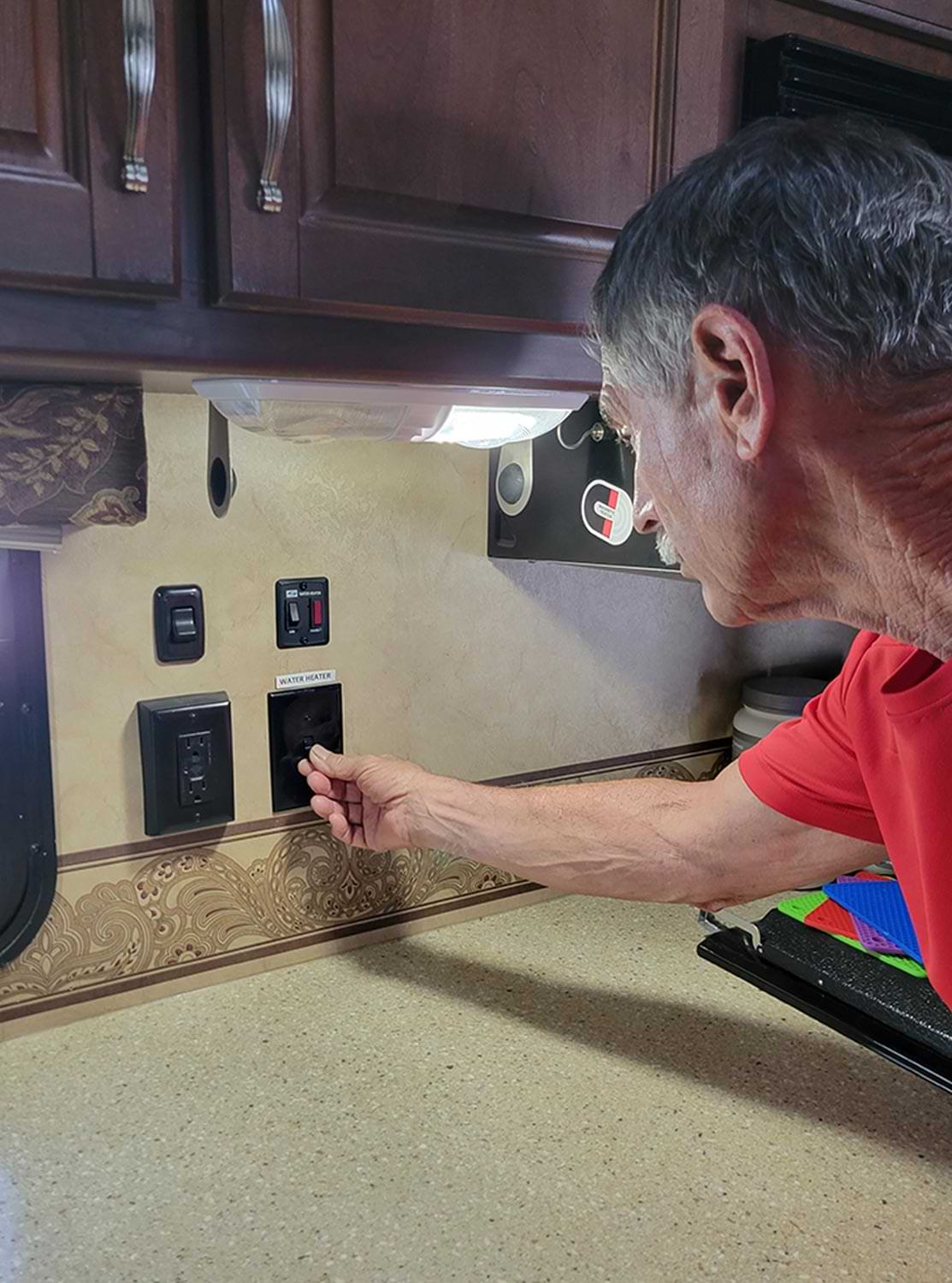 technician turns off the switch for the water heater