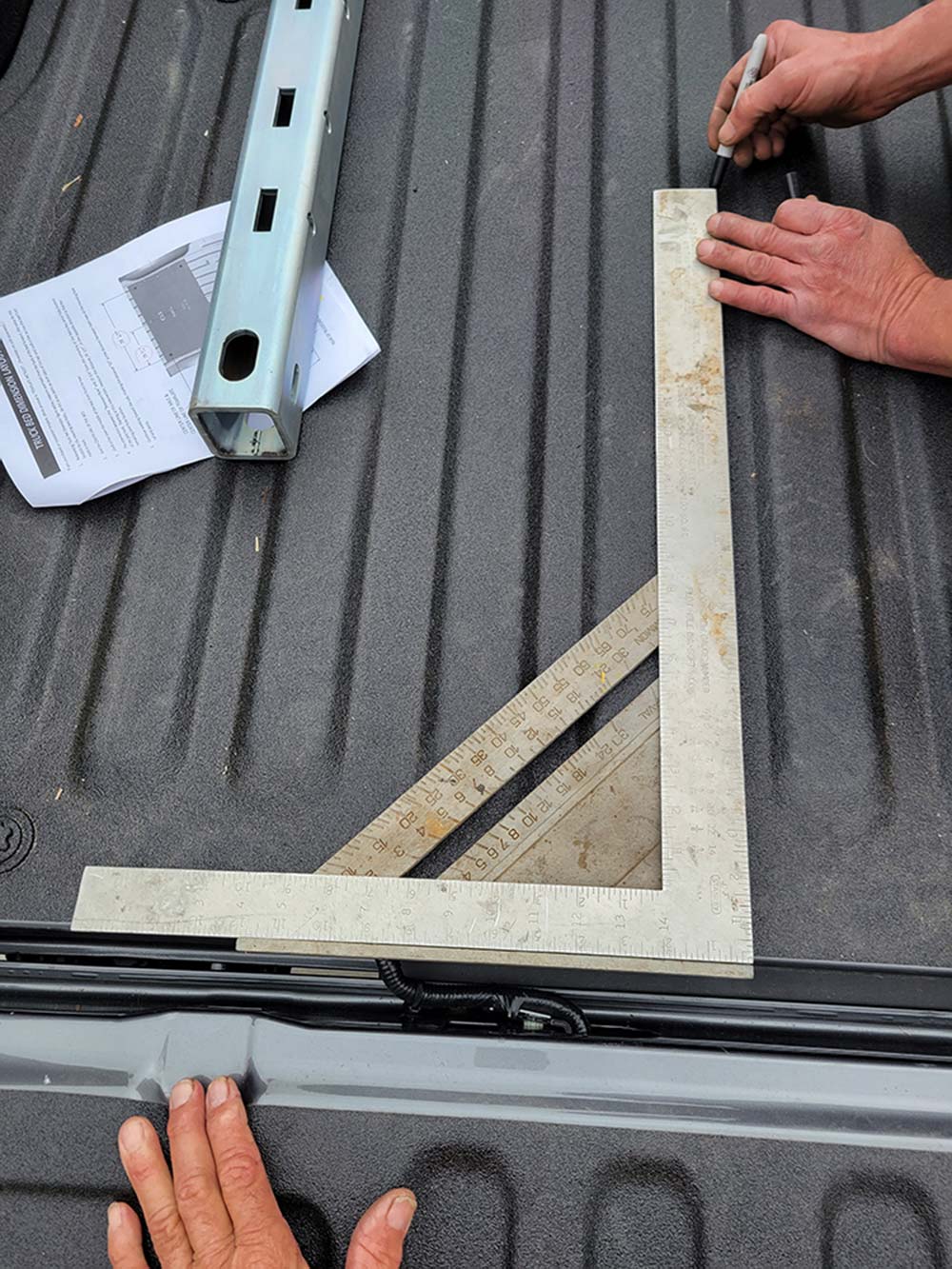 using square to mark straight line in truck bed
