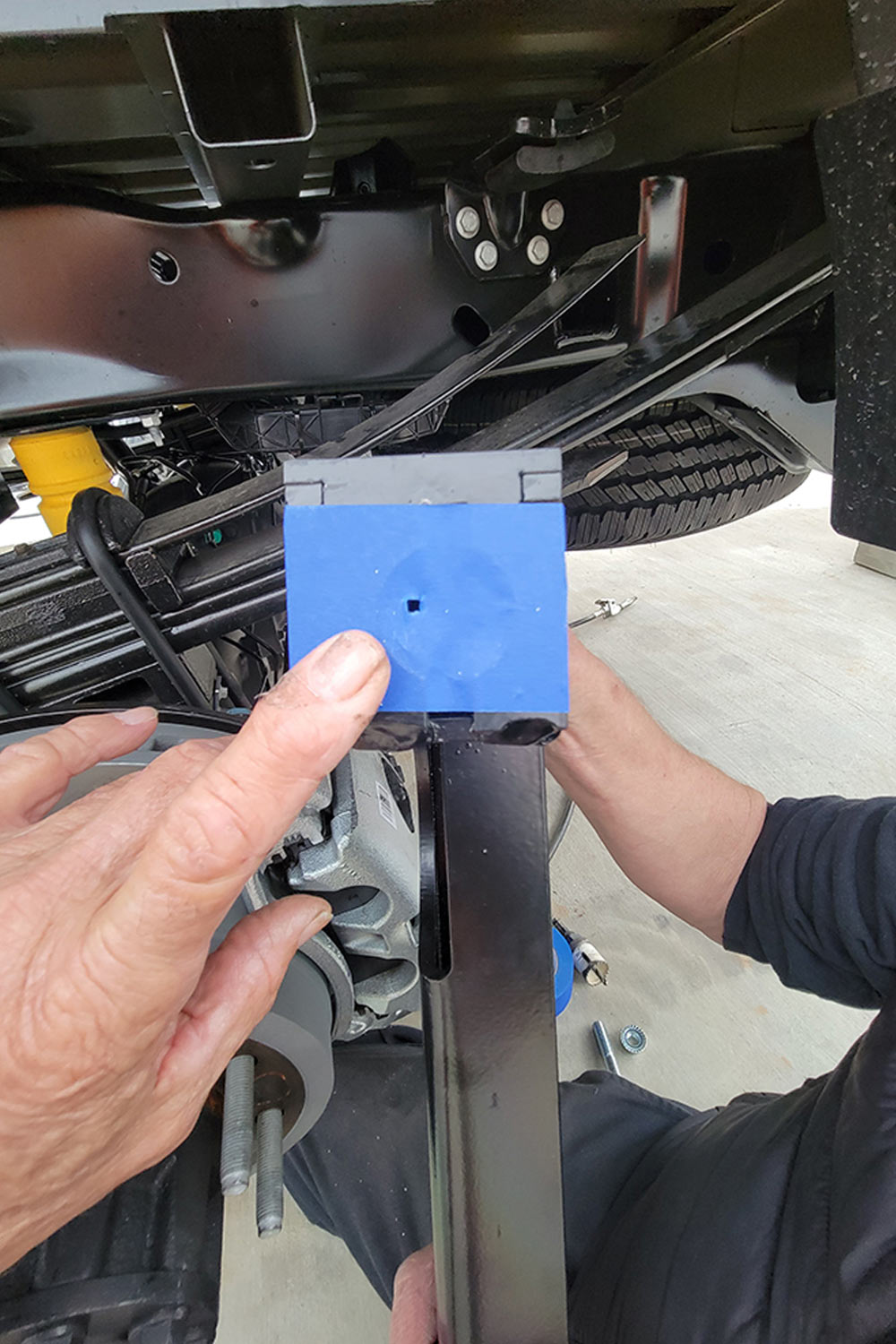 checking hole in tape on bracket