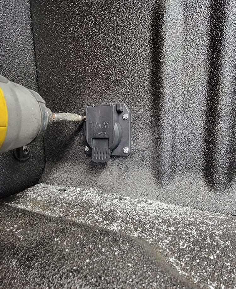screwing receptacle onto sidewall
