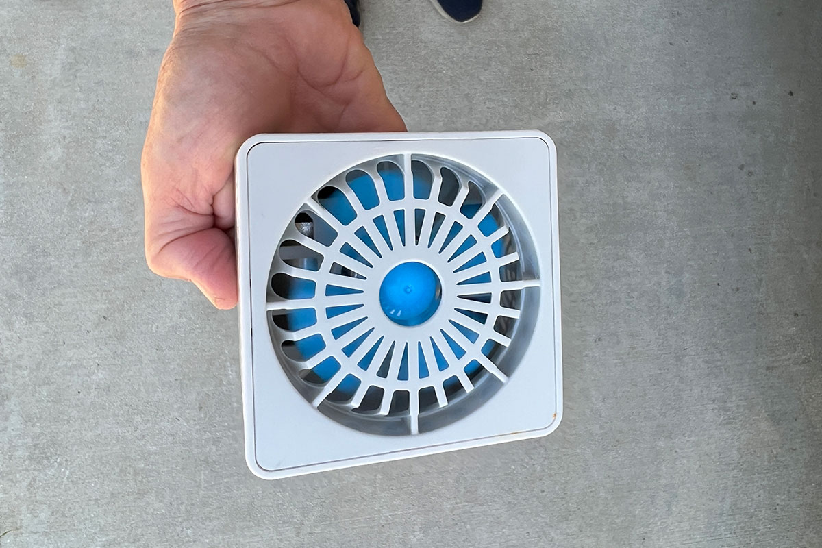 top view of the “spiderweb” top vent held in one hand