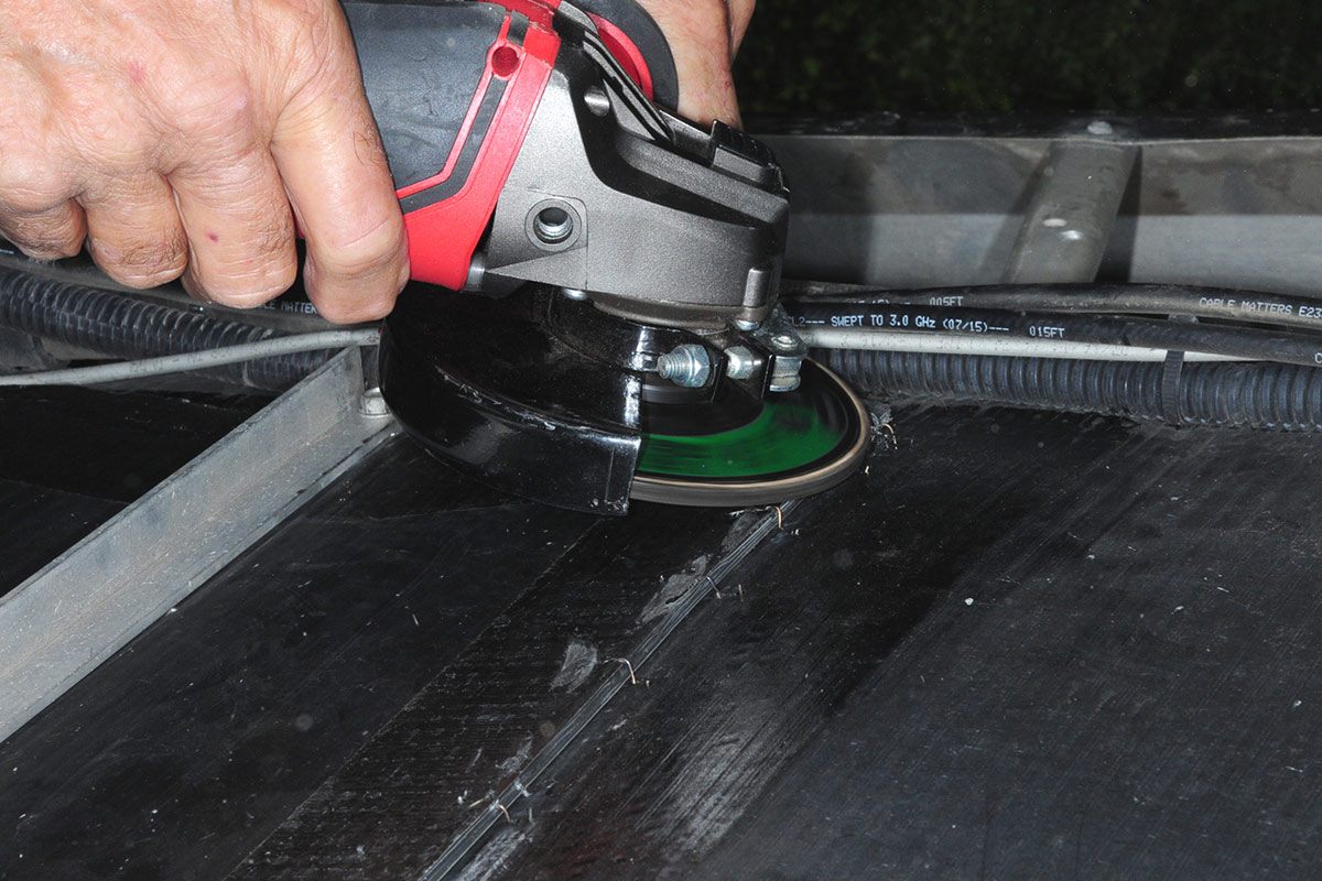 a grinding plate is used to remove protruding staple ends and edges