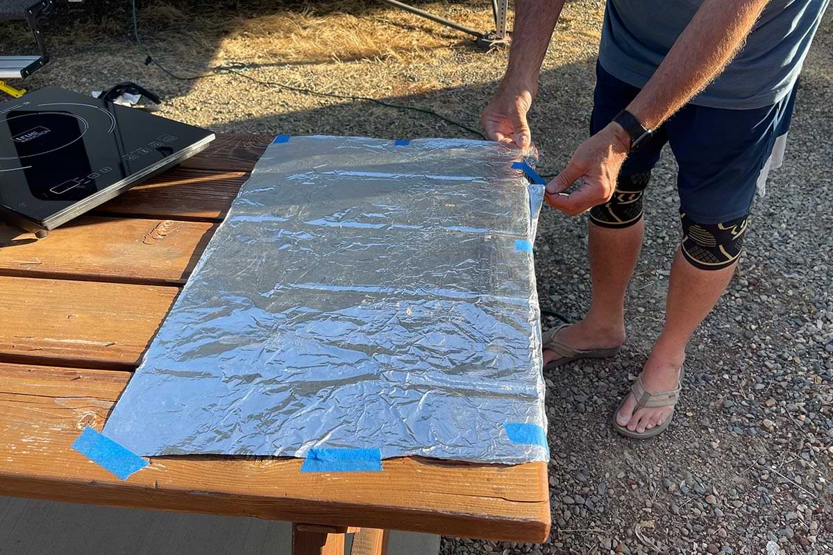 the table cooking area is covered with heavy-duty aluminum foil to prevent making a mess