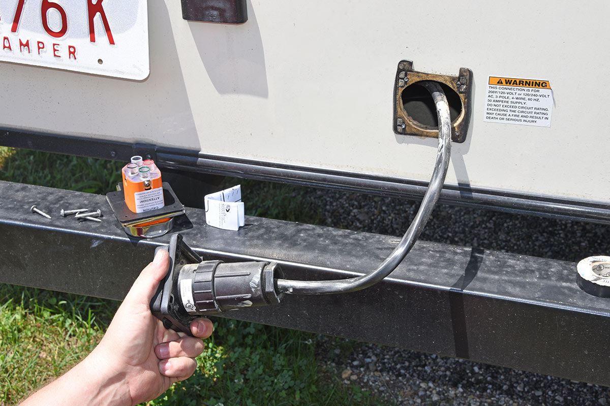the original RV receptacle is pulled from the RV exterior