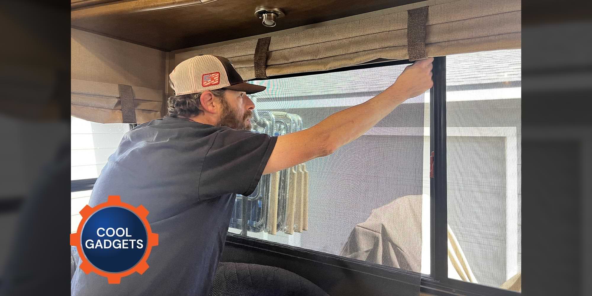 a man applying a Nano Shade to wide RV window