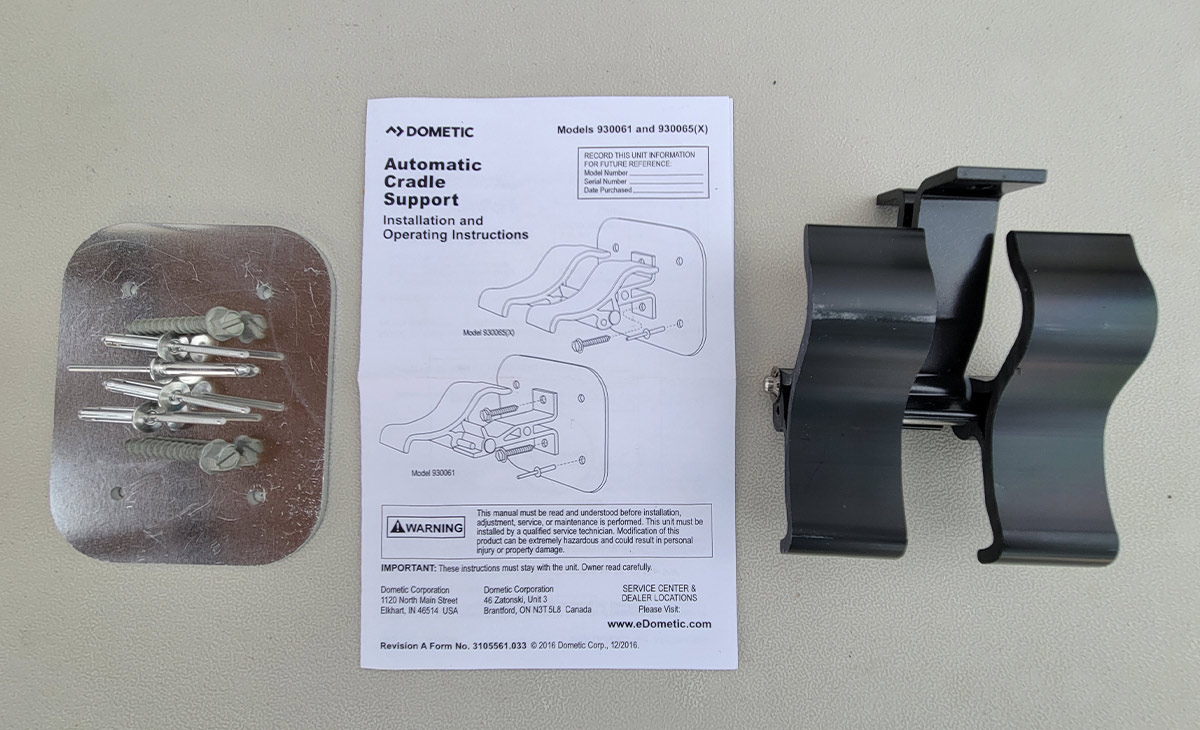 Dometic’s Automatic Cradle Support kit including a double rotating cradle, a reinforcement (backing) plate, the necessary hardware and instructions