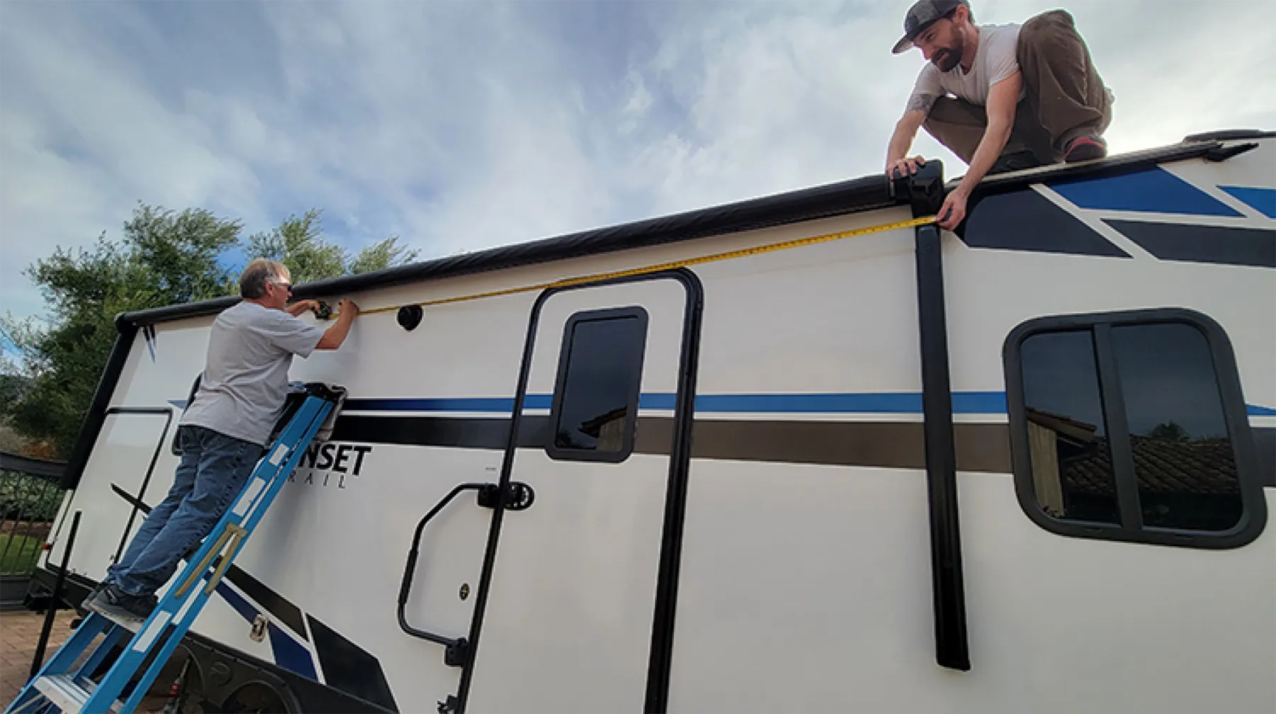here the awning spans almost the entire length of the trailer, making the cradle assembly necessary to prevent sagging