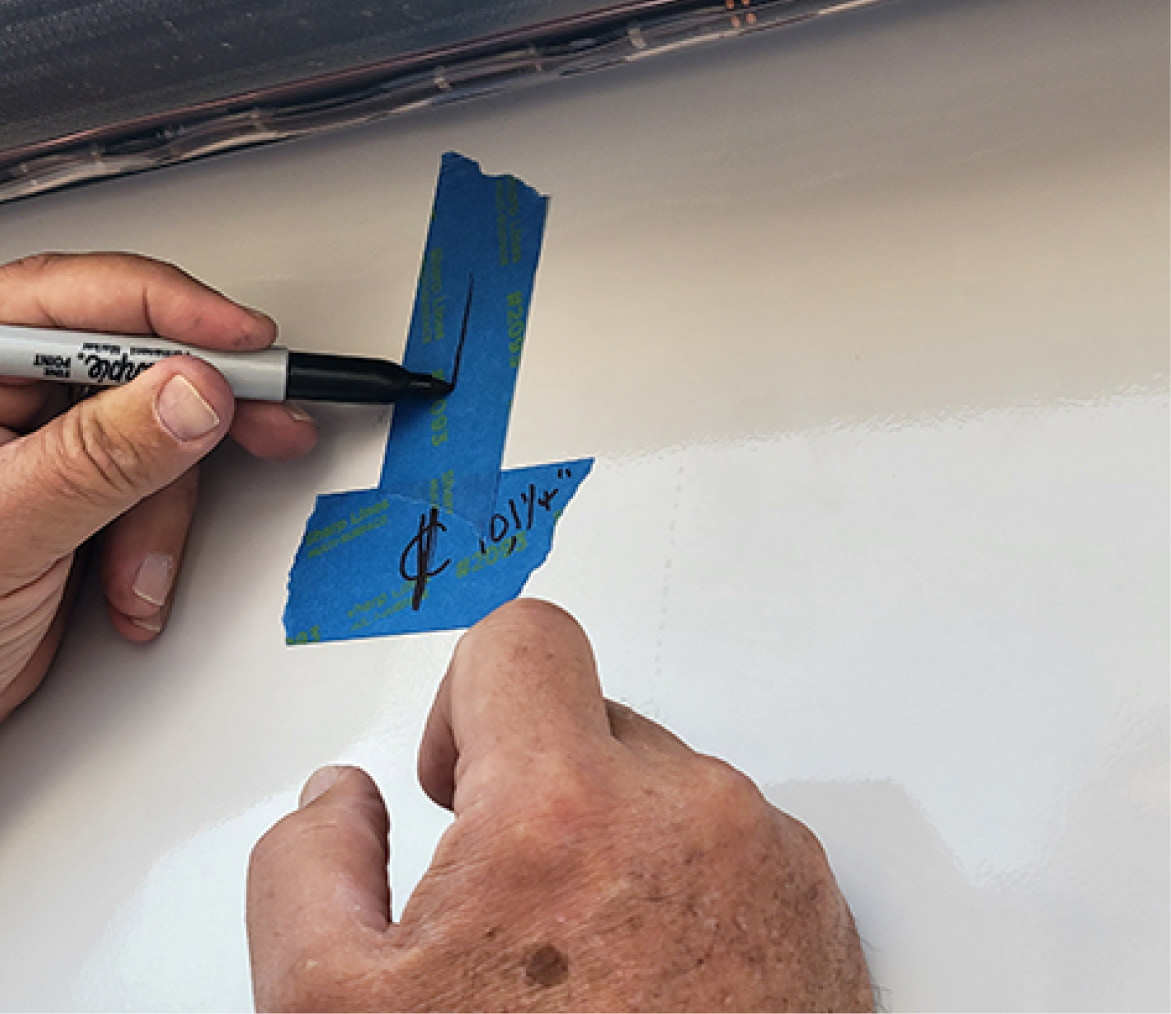 with the center point is established, painter’s tape is used to mark the proper location of the cradle assembly