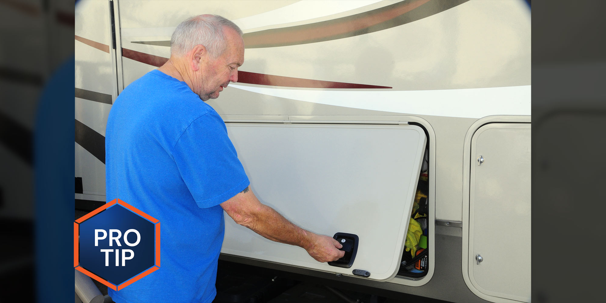 a man closes the door of an RVs external compartment