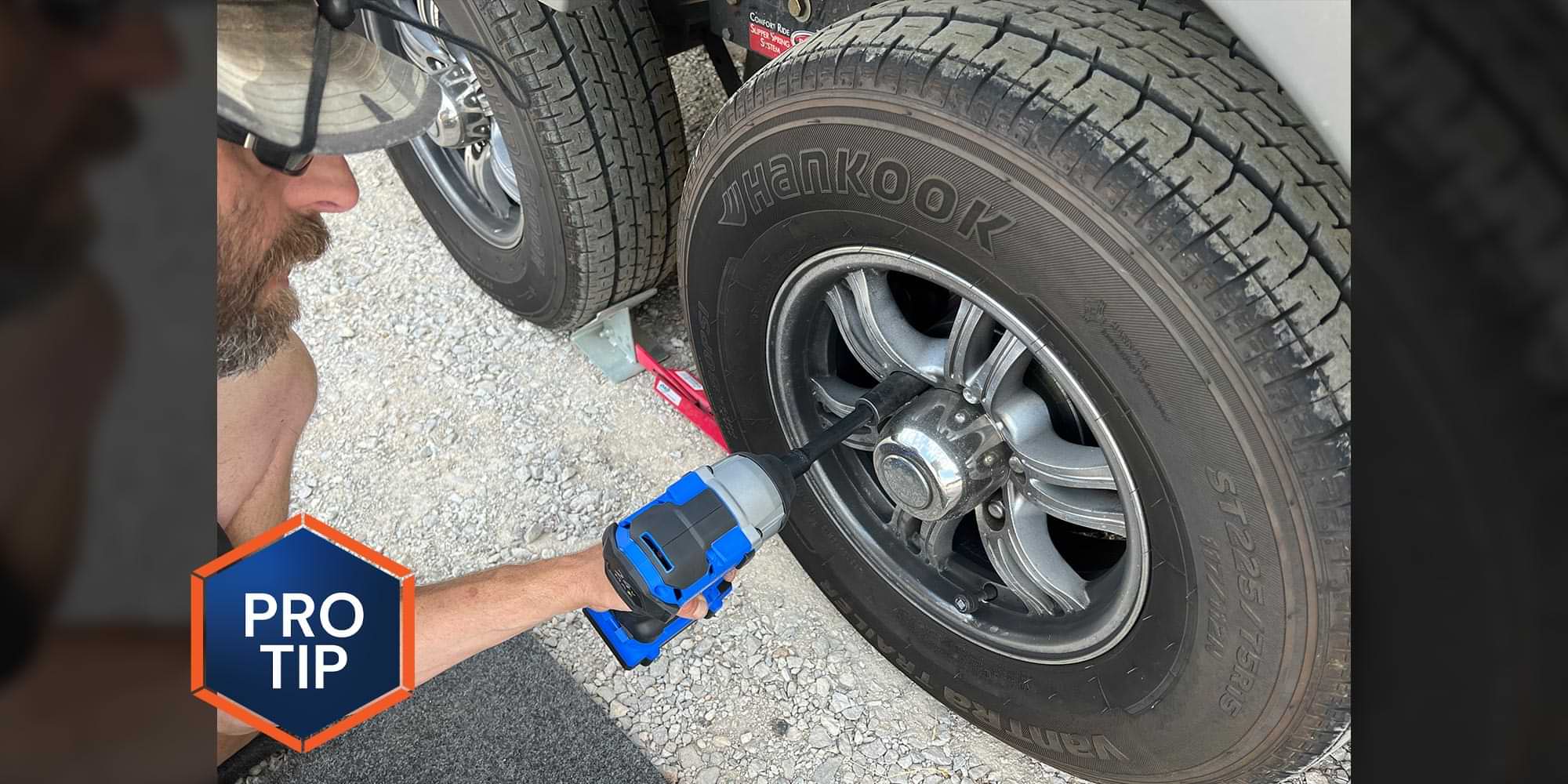 an impact gun is used on a tire lug nut