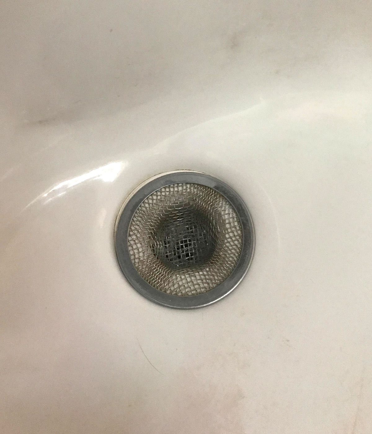 a Camco covers the drain of a bathroom sink