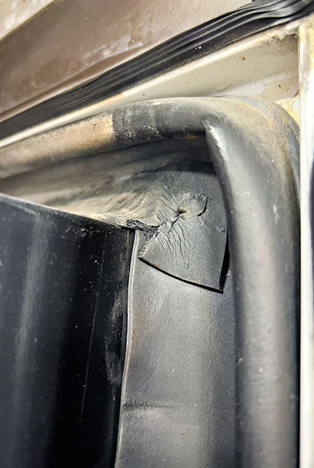 close up of a cracked corner on slideroom wiper seal