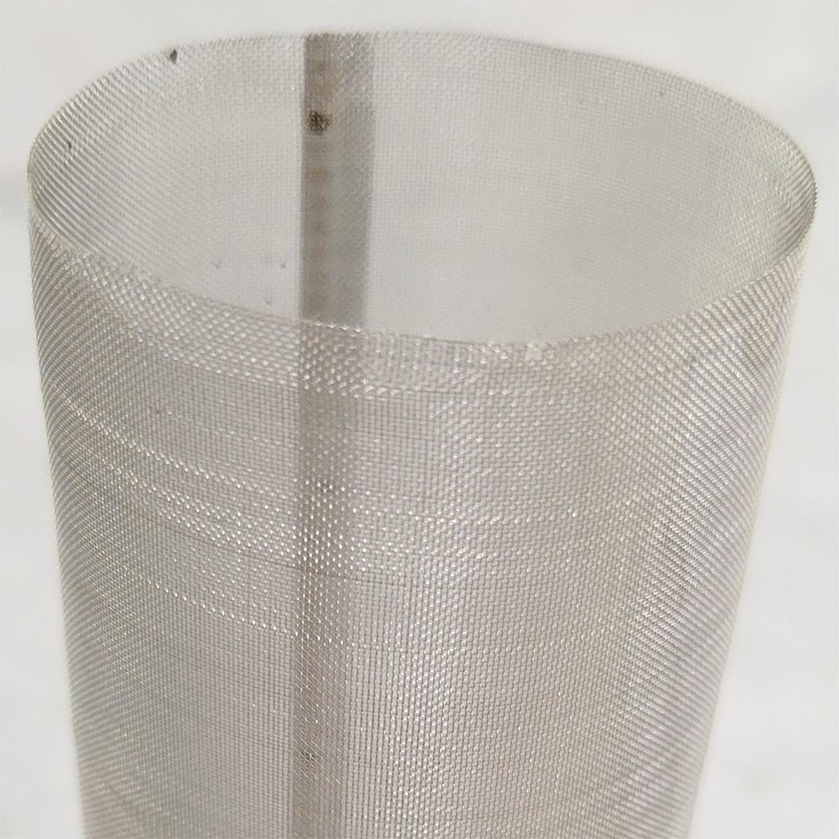 zoomed in view of a cylindrical mesh filter