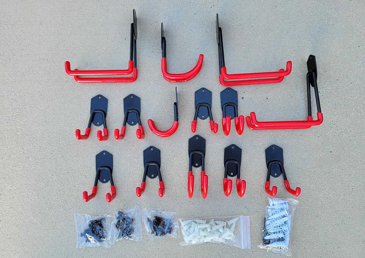 top view of the assortment of hooks from the TORACK Garage Hooks Heavy Duty package layed out in a organized way with the accompanying screws and fasteners placed below