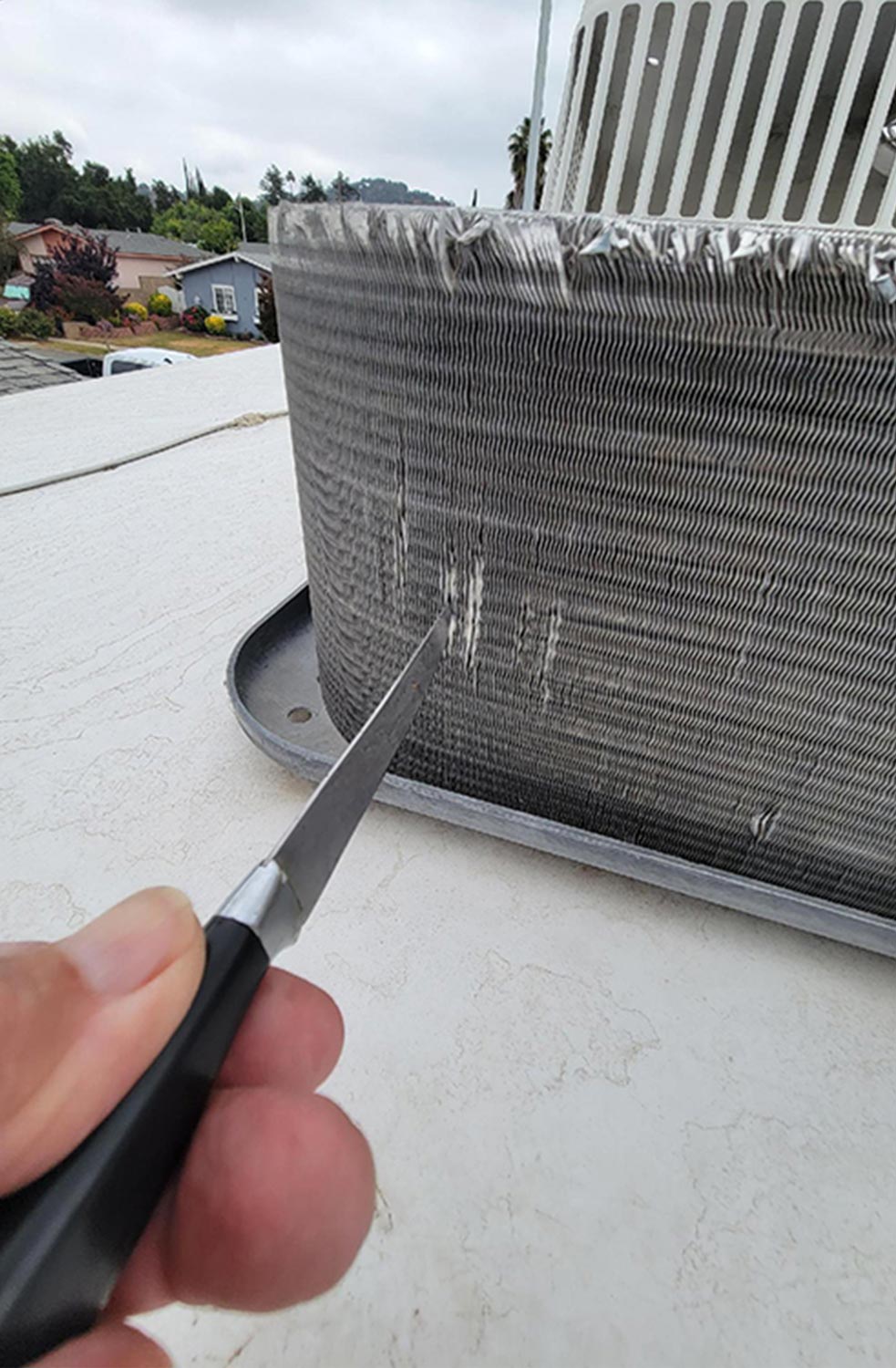 condenser fins are straightened with the help of a dull knife