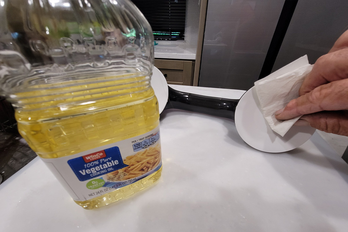 a thin coating of vegetable oil is applied to one of the suction cups on the Helping Handle