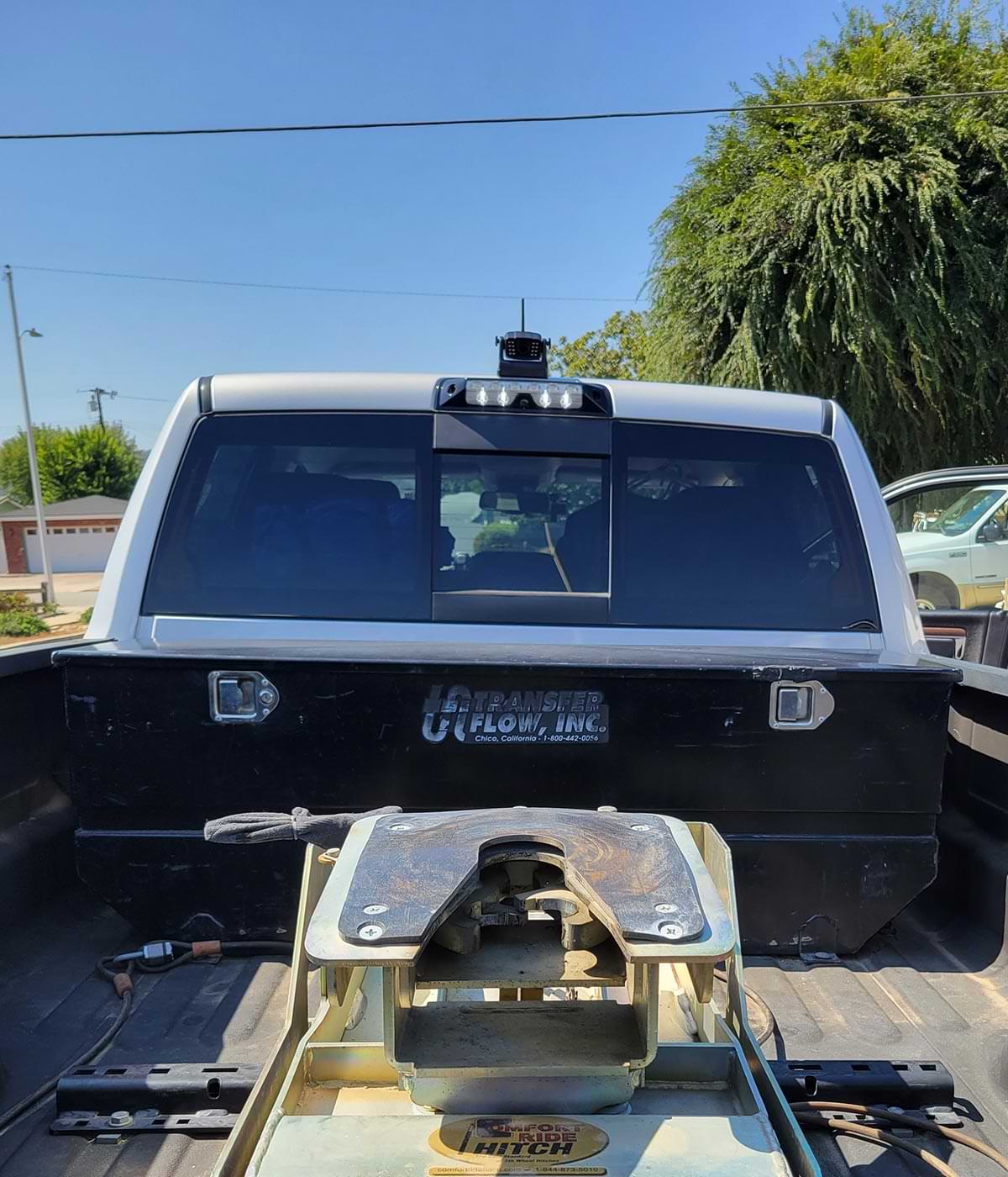 back view of a heavy duty pickup truck with the DoHonest camera mounted atop the cab