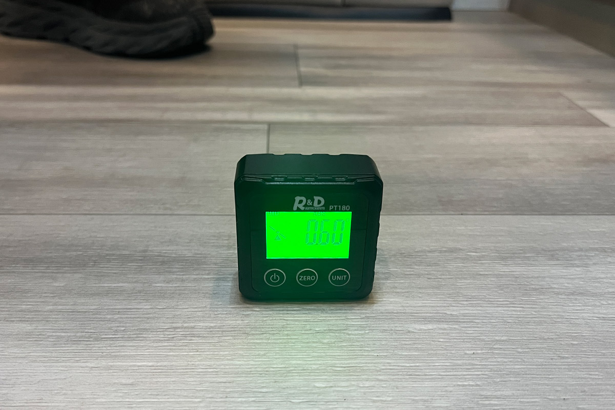 the Digital Angle Finder on an RV floor reads 0.60°