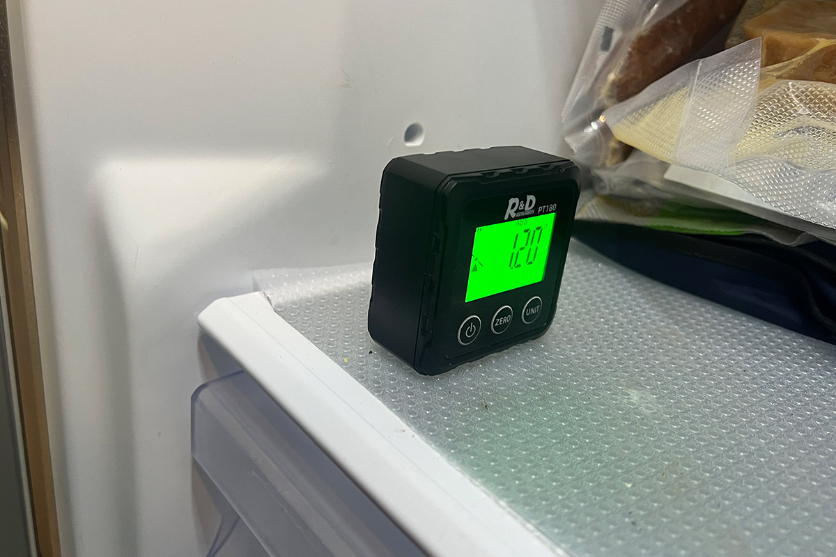 the Digital Angle Finder on a freezer compartment shelf reads 1.20°