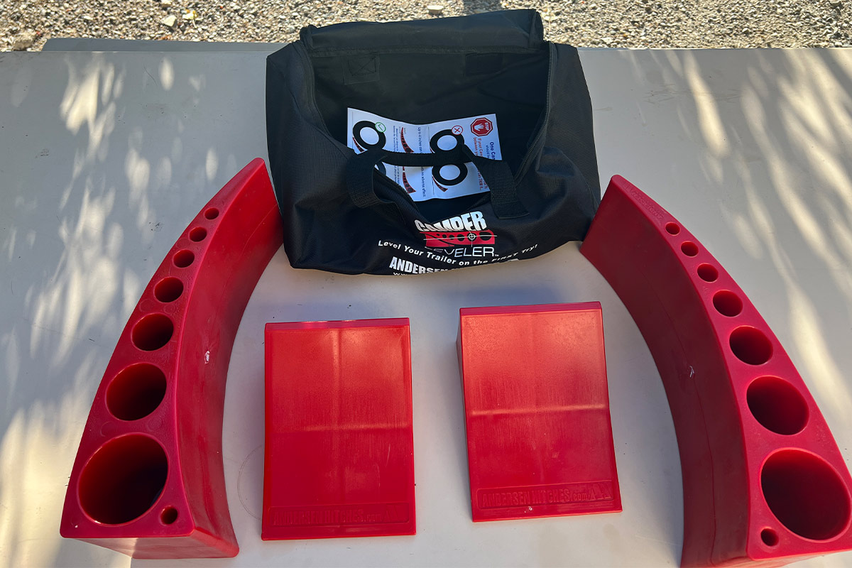 top view of the Andersen Camper Leveler kit parts and accompanying carrier bag